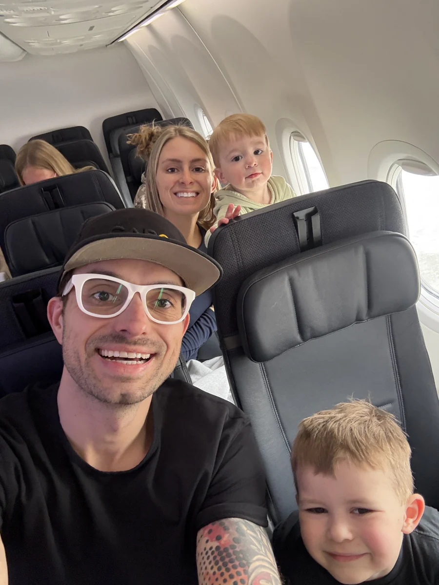 Slavik Lund with his wife and son on an airplane